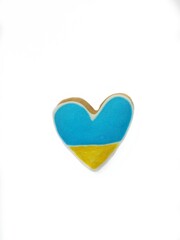 Plate with Two Heart shape ukrainian colours blue and yellow national flag gingerbread cookies on table. Flat lay, copy space