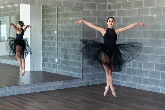 Young ballerina posing on points