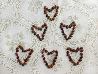 seed hearts on a vintage background. beans. craft. handmade. background