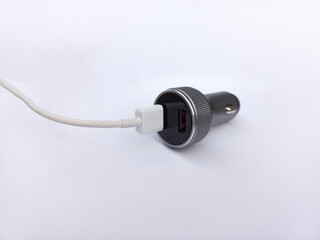 Black USB electronics device car charger isolated on white