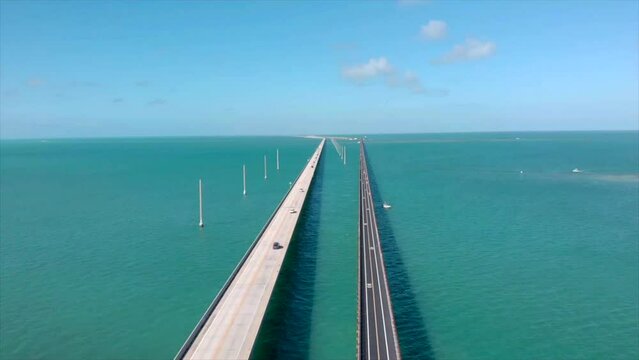 Static double highway aerial drone shot of 7 Mile Bridge in Florida Keys with cars