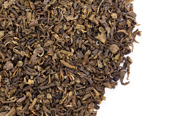 Dried green tea leafs background.