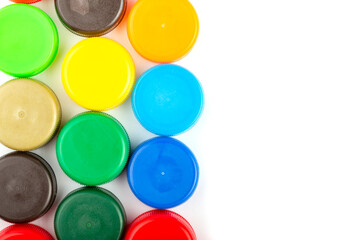 Сolorful plastic caps on white background, recycle for environment concept. Separate waste sorting. Space for text.