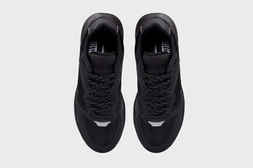 Black classic leather high sole sneakers isolated on white background. Women's laced footwear, sports basketball running shoes, boots for female, women. Template, mock up. Flat lay, view from above