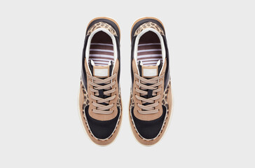 Beige fashionable men's leather slip-on shoes sneakers for male isolated on white background. Pair...