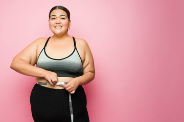 Stressed fat woman worried about her body measurements
