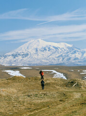 Panoramic view of the high mount Elbrus
observers for a snow-covered high mountain in a haze