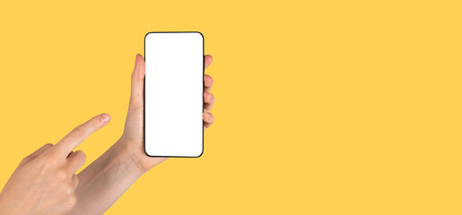 Banner with forefinger pointing to phone mockup on orange background. template with empty screen. Copy space