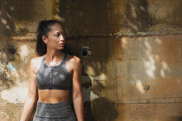 Portrait of a fit and healthy Asian woman in fashion sportswear