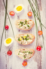 Vintage photo, Baguette with mackerel fish paste and ingredients for preparing sandwiches