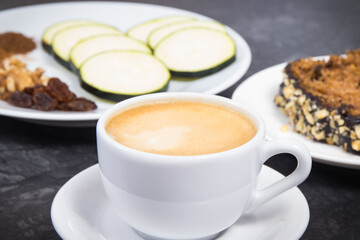 Fresh pastry made of zucchini and cup of white coffee. Delicious dessert