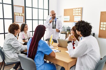 Group of young doctor discussing in a medical meeting at the clinic office.