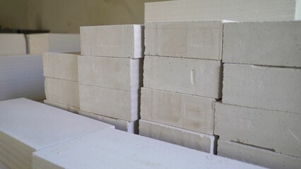 Thin white building blocks for partition walls. Partition gas silicate blocks are laid in the...