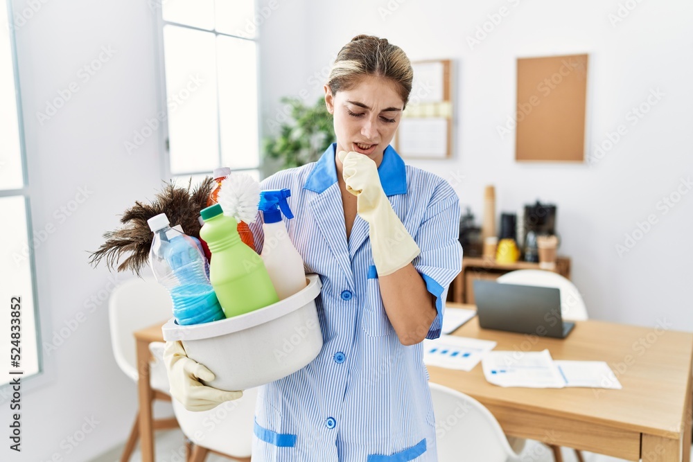 Poster young blonde woman wearing cleaner uniform holding cleaning products feeling unwell and coughing as 