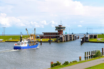 A fishing ship driving out the port of Büsum