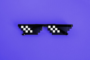 Funny pixelated boss sunglasses on new blue background. Gangster, Black thug life meme glasses . Pixel 8bit style. Color of the Year 2022. Very Peri
