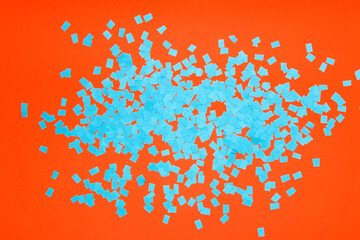 abstract orange background with blue chopped paper, creative art design with complementary colors
