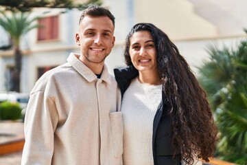 Man and woman couple smiling confident standing together at park
