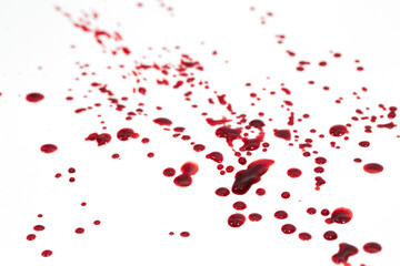 Fototapeta na wymiar Drops of blood staining spots on a white background, medecine, drug addiction, killing