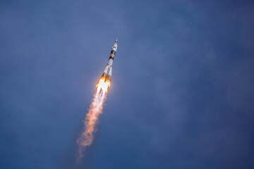 Take-off of a real launch vehicle from a spaceport. A rocket takes off into the sky against a...