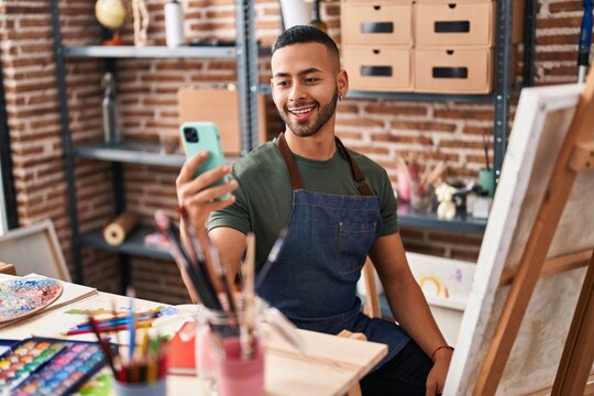 African american man smiling confident having video call at art studio