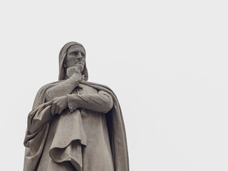 Detail from Dante Alighieri monument at the center of Piazza dei Signori, in Verona (19th century), with copy space - Verona city - northern italy