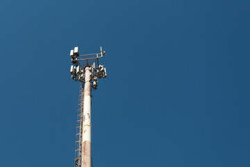 Cell tower against the blue sky