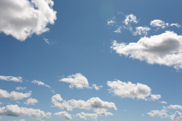 white clouds on blue sky background in the summer