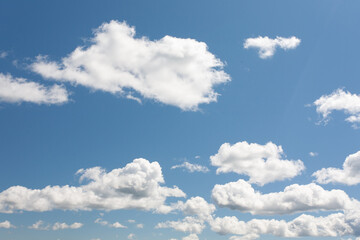 white clouds on blue sky background in the summer