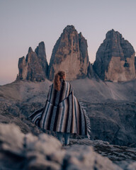 a tourist in front of the Three Peaks of Lavaredo (Drei Zinnen) in the Dolomites