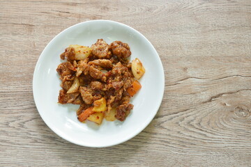spicy stir fried chicken and bell pepper with chili paste on plate
