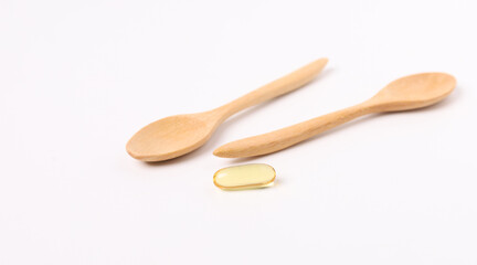 fish oil capsules fish with omega 3 and vitamin D on white background and supplements concept