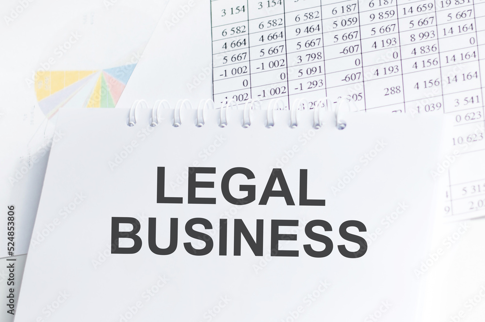 Poster legal business text on notepad on the background of reports and charts