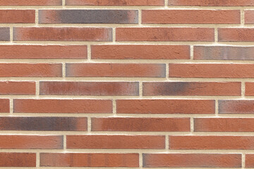 Obraz premium Decorative Relief Facing Plates Imitating red Brick On The Wall. Textured brick background.