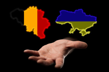 relations between the countries of Ukraine and Belgium assistance to Ukraine in the war, maps of countries in hands on a dark background