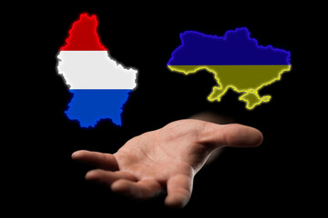 relations between the countries of Ukraine and Luxembourg, assistance to Ukraine in the war, maps of countries in hands on a dark background