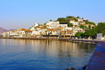 Fototapeta na wymiar View from the sea in the morning hours on the buildings and cafes of the old city in Marmaris. Turkey
