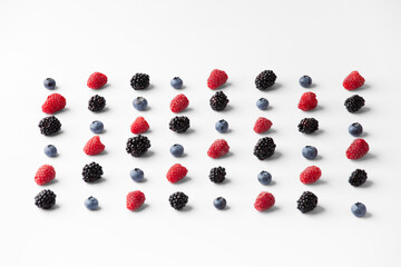 Seamless pattern with Flatley raspberry blackberry and blueberry.