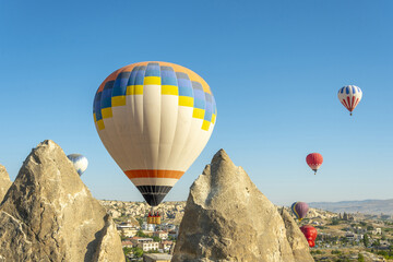 Hot air balloon flight over Cappadocia, Turkey, Goreme village, hot air balloon parade