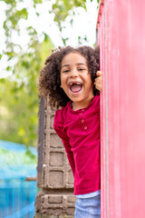 happy girl playing in a park	