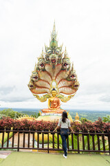 Buddha image in meditation posture at Tham Pha Dan Temple, Sakon Nakhon Province, Thailand.