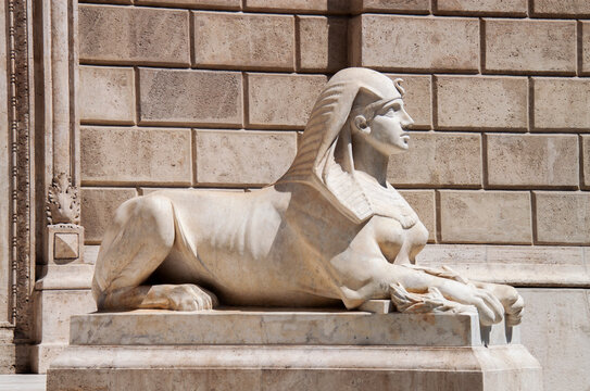Outdoor detail on Andrassy Avenue, downtown Budapest, Hungary, Europe. The ancient Siren Sphinx statue is guarding the entrance of the State Opera House. Mythical half-human creature, stone sculpture.