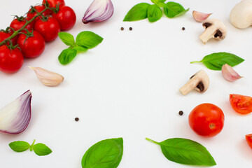 Tomatoes, mushrooms, spices and fresh herbs on a white background. Ingredients for cooking. Copy space