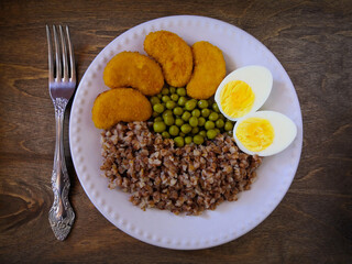 Useful and tasty breakfast. Egg, buckwheat, green peas