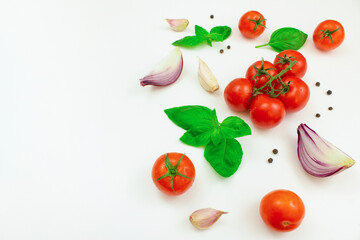 Tomatoes, mushrooms, spices and fresh herbs on a white background. Ingredients for cooking. Copy space