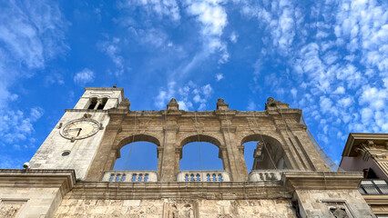 Fototapeta premium Clocktower of Sedile Palace, headquarters of Bari's Council of Nobles, old town hall, Apulia, southern Italy