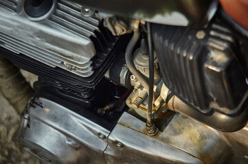 The carburetor of the vintage motorcycle