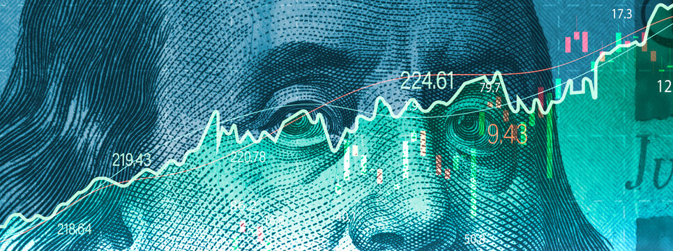 Closeup Benjamin Franklin face on USD banknote with stock market chart graph for currency exchange and global trade forex concept.