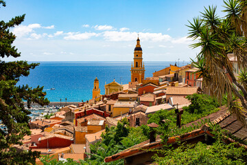 Menton, France. Aerial view of the old town architecture and the Basilica of Saint Michel Archange....