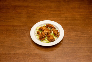 Sweet or Chinese chicken wings are a sweet dish of chicken wings seasoned with soy sauce served in some restaurants in Hong Kong